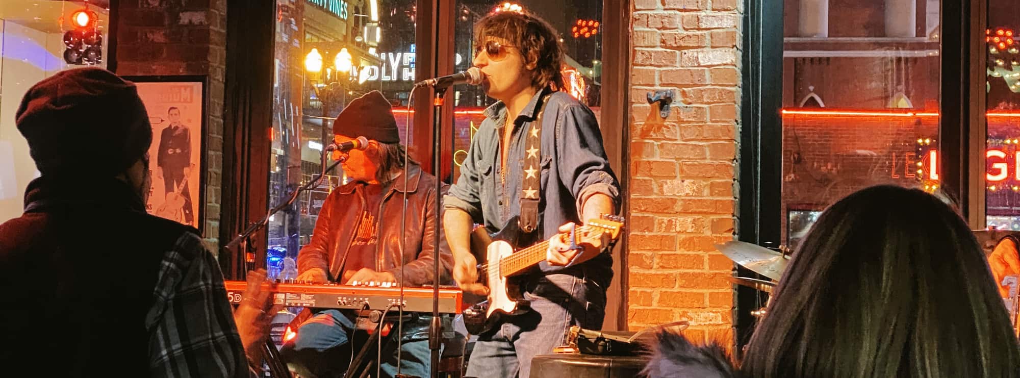 bar singer on guitar in Tulsa